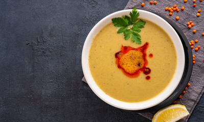Delicious lentil soup on vintage background