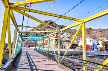 Tenerife, Spain - December 25, 2023: Colorful footbridge linking San Andres to Playa de las...