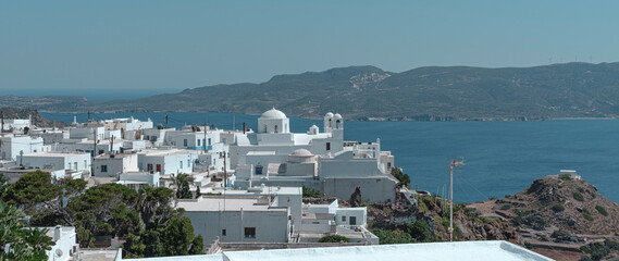amazing view of Greek churches on Milos island, whitewashed architecture, traditional orthodox culture, landscape, top on hill