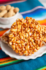Plate of traditional peanut brittle or palanqueta, mexican candy