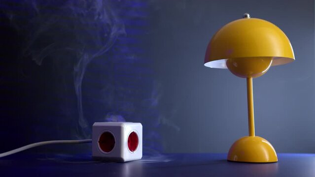 extension socket overheats, emitting thick white smoke. yellow lamp and white cord compose scene as fire truck siren blares outside, signaling house fire.