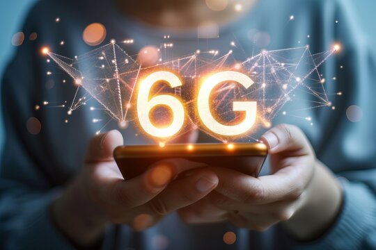 Holographic 6g text icon over mobile phone, futuristic concept with interactive display in hands