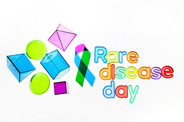 Rare Disease Day Background. Colorful awareness ribbon on white background