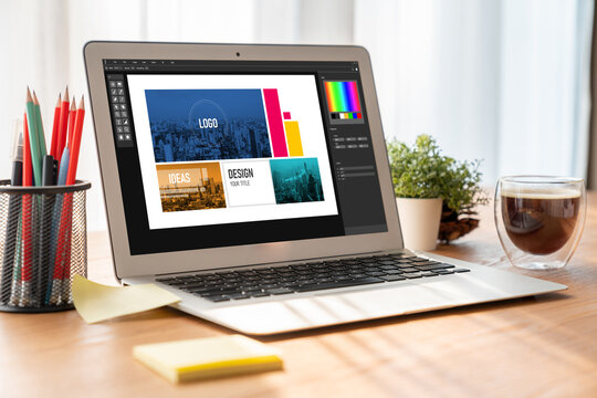 Graphic designer software for modern design of web page and commercial ads showing on the computer screen