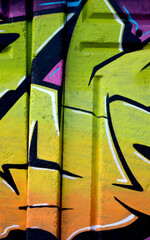 Colorful background of graffiti painting artwork with bright aerosol outlines on wall. Old school...