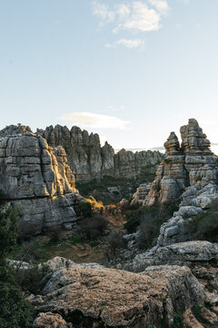 Golden sunlight bathing the unique karst formations at Torcal de Antequera during sunset