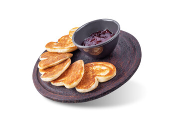 Pancake in the form of heart for Valentine's day holiday on a white isolated background