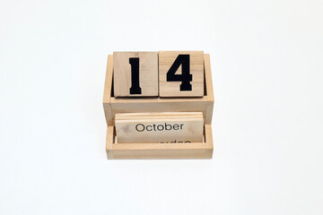 14th of October wooden perpetual calendar. Shot close up isolated on a white background 