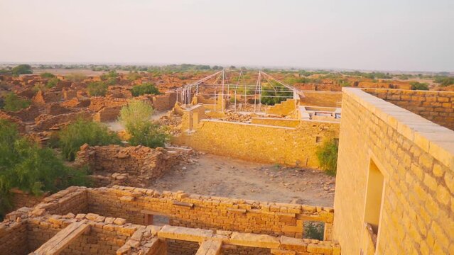 View of Haunted village Kuldhara near jaisalmer in Rajasthan, India. Mysterious ruined village. Old houses made of yellow sand stone at Jaisalmer in Rajasthan.
