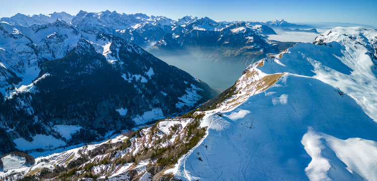 Aerial drone view of snow covered ski slopes at Stoos,Switzerland