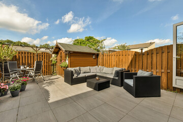 Cozy backyard patio with modern garden furniture