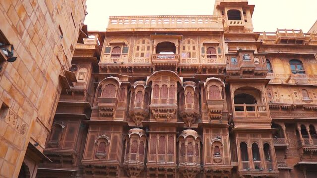 View of magnificent Patwon Ki Haveli at Jaisalmer, Rajasthan, India. Intricate carvings and artwork at Patwon ki Haveli mansion made of yellow sand stones.