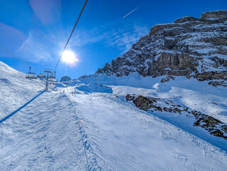 Aerial panoramic winter landscape in Swiss Alps, famous Engelgerg - Titlis ski resort, Switzerland