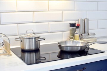 Cooking food on a modern induction stove.