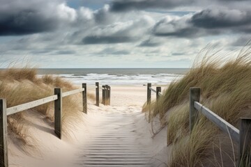 sand dunes and beach with wooden walkway