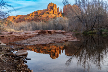 Cathedral Rock sunset at Oak Creek with reflection. Sedona, Arizona in winter
