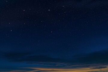 Fototapeta na wymiar Starry Night Sky Over Tranquil Horizon