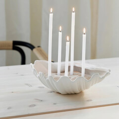 beautiful decorative white five candles on the stand