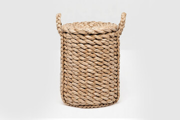 wicker basket for laundry or household items isolated on white