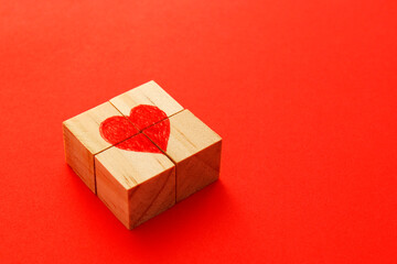 Wooden cube puzzle forming a heart in its center