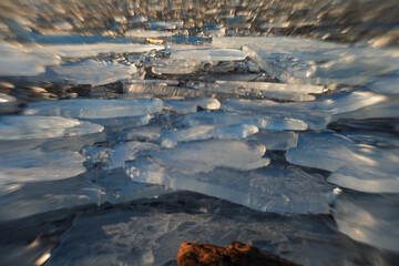 Winter landscape. Ice floes on the lake.
