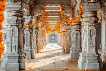 Tuinposter A tranquil hallway in an Indian temple adorned with intricate stone carvings and marigold garlands under warm sunlight. © apratim