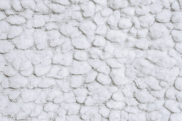 Texture of white cotton fabric with fleece like sheepskin. Close up. © nskyr2