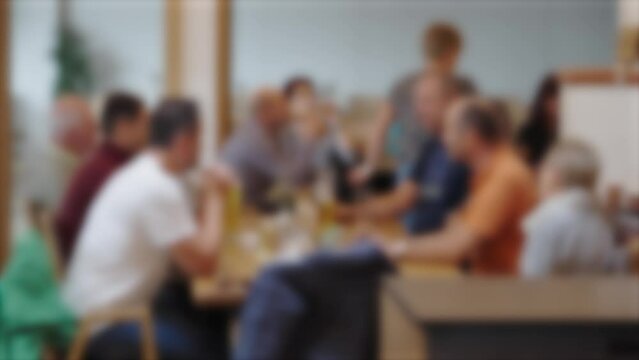 guests at restaurant table defocused