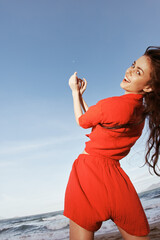 Joyful Smiling Woman Dancing with Freedom on the Sunny Beach