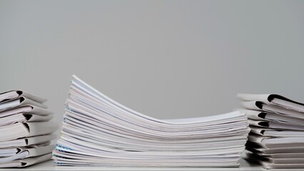 Time lapse of paper sheets on white background. Stop motion animation of sheet folders stacks and...