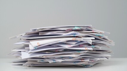Time lapse of paper sheets on white background. Stop motion animation of big heap of business paper...