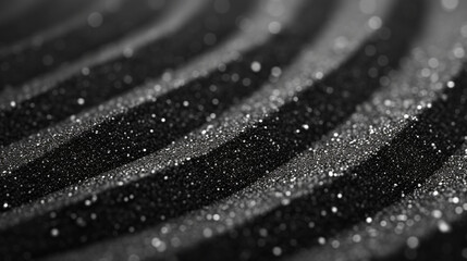 Black Sand Texture Background with Muted Surrealism Effect Showing Mounds, Waves, and Granules of...