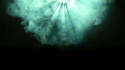 Studio shot of projector haze isolated on black background. Green light rays shining from above...