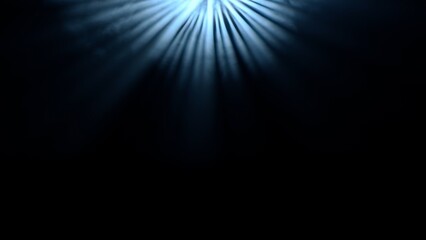 Studio shot of projector haze isolated on black background. Blue light rays shining from spotlight...