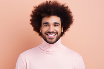 Fototapeta na wymiar Smiling young man with Afro in casual pink turtleneck, perfect for lifestyle and fashion marketing