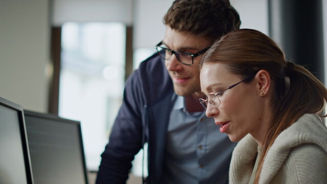 It programmers discussing project in office closeup. Hands typing computer code