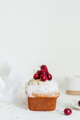 Homemade nut cake with cherrys on white background. Aesthetic breakfast concept.