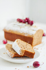 Homemade nut cake with cherrys on white background. Aesthetic breakfast concept.