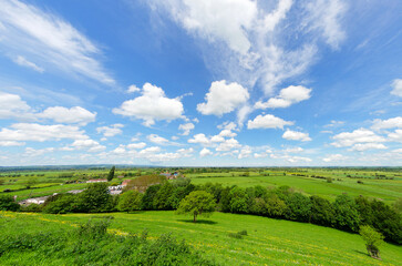Views from Burrow Mump overlooking the surrounding countryside of Southlake Moor in Burrowbridge Somerset on a sunny day
