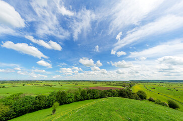 Views from Burrow Mump overlooking the surrounding countryside of Southlake Moor in Burrowbridge Somerset on a sunny day
 - obrazy, fototapety, plakaty