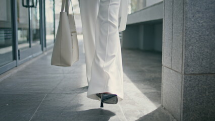 Stylish woman legs walking office in high heels closeup. Girl feet going on work - obrazy, fototapety, plakaty
