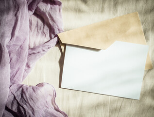 blank greeting card invitation mockup with craft paper envelope feminine still life composition