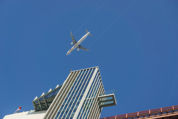 Looking up at an air plane in the sky at Museum and Elevator at the Pilar 7 on the Ponte 25 de...