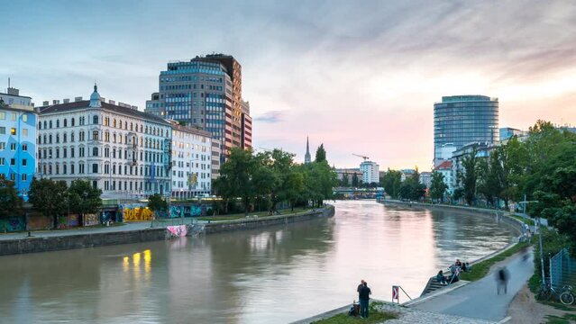 Vienna donaukanal (Danube Canal), vienna city skyline aerial view time lapse from day to night, vienna austria cityscape skyscrapers view.