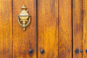Metal detail of an old wooden door, close-up