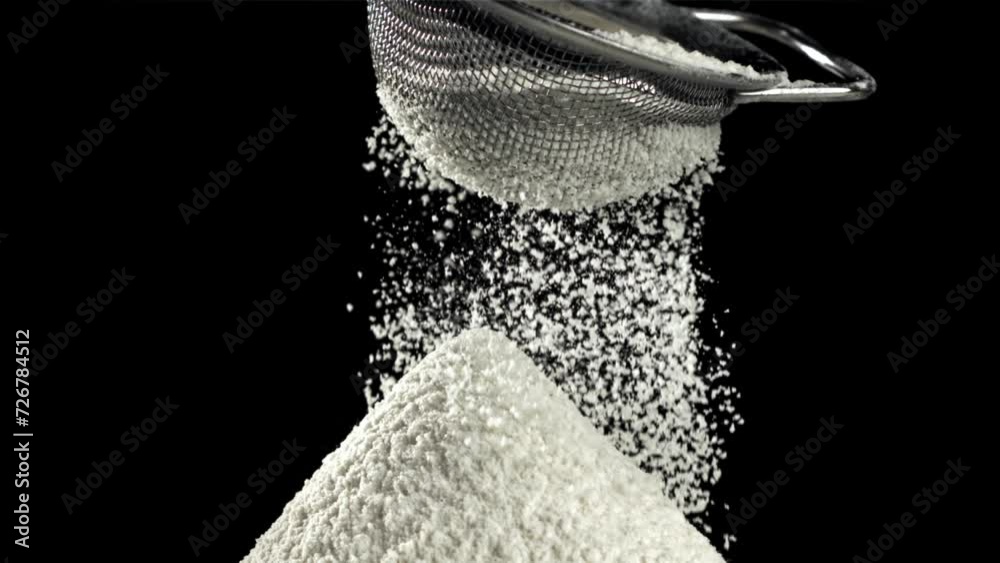 Poster The flour is sifted through a sieve. On a black background. Filmed on a high-speed camera at 1000 fps. High quality FullHD footage