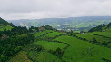 Fototapeta premium Drone greenery slopes thunder clouds nature. Green mountain hills environment