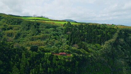 Fototapeta na wymiar Aerial peaceful green hills summer day. Lush forest mountain slopes landscape