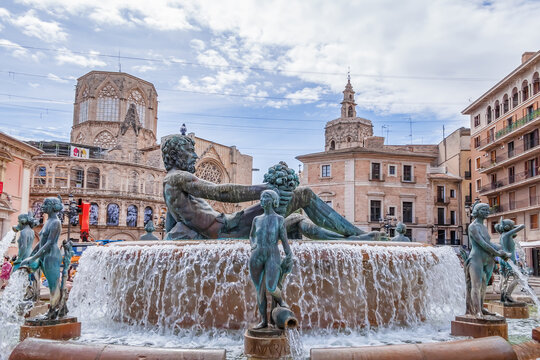 Turia Fountain (Fuente del Turia, 1976) on Plaza de la Virgen. Turia Fountain represents Turia River and depicts Roman god Neptune; sculptor Silvestre Edeta. VALENCIA, SPAIN. APRIL 14, 2023.