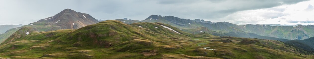 Fototapeta na wymiar Summer mountain panorama in the tundra with sun rays